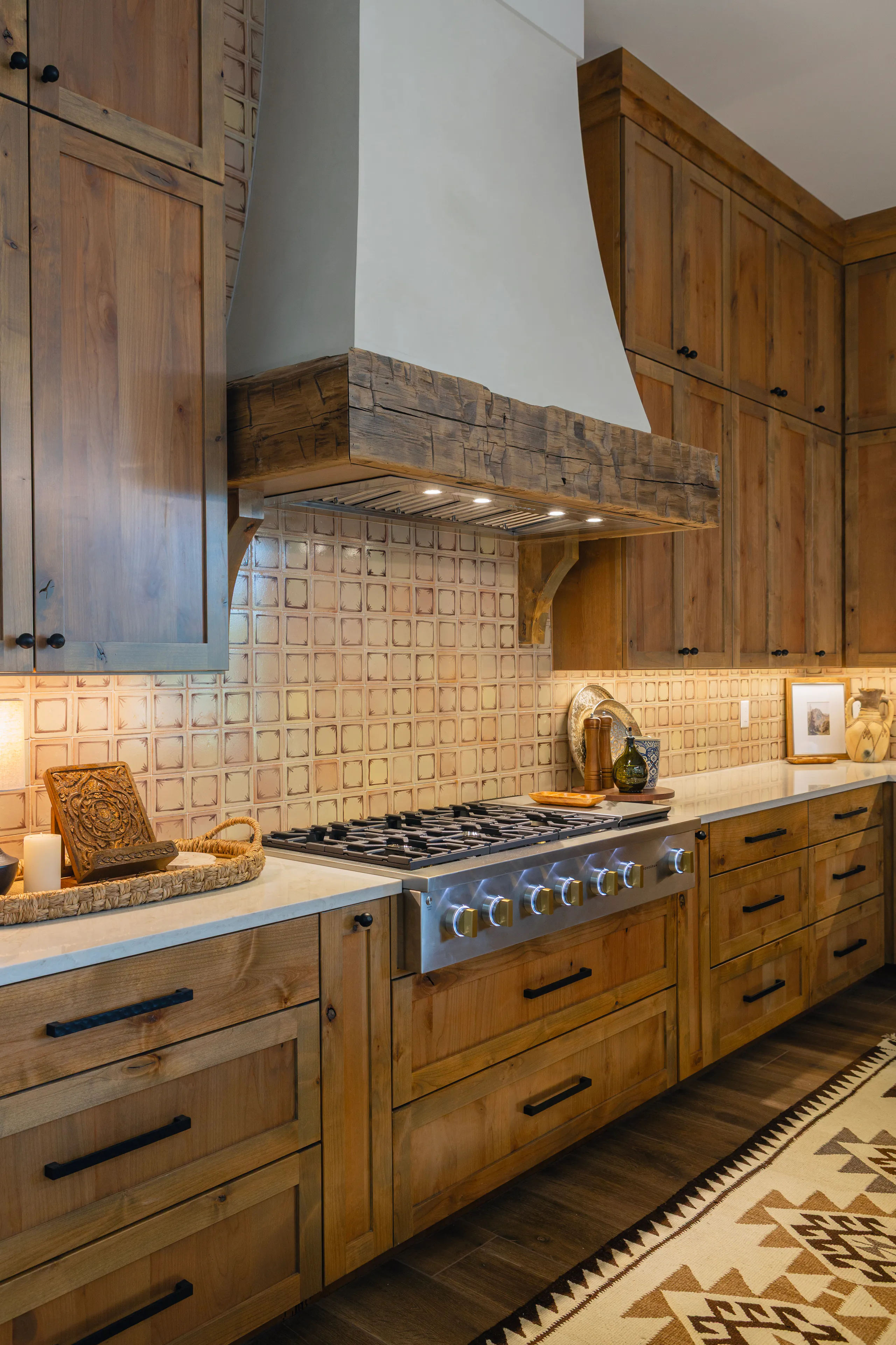 Custom kitchen with professional range and tile backsplash