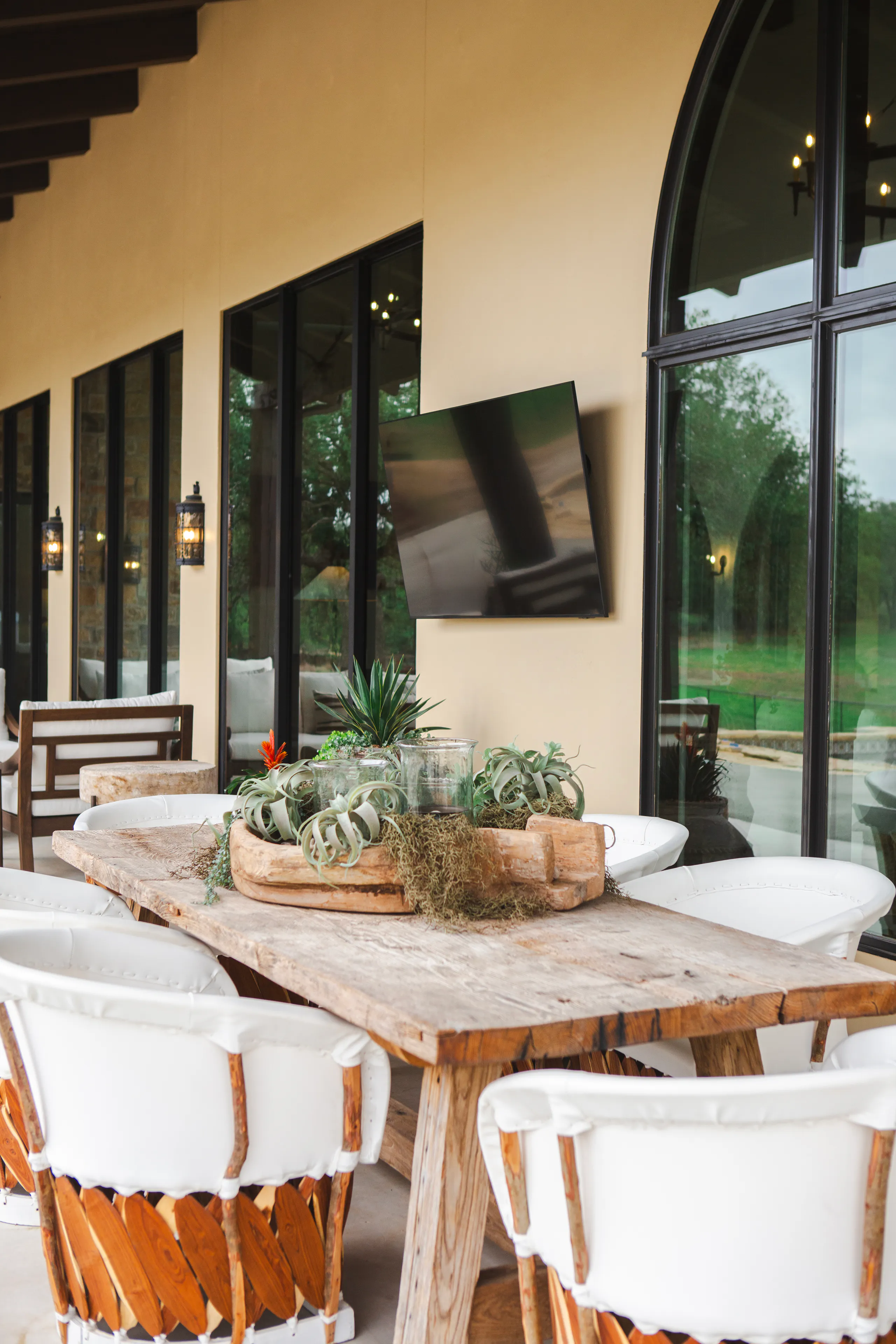 Covered outdoor living room with fireplace and Hill Country views
