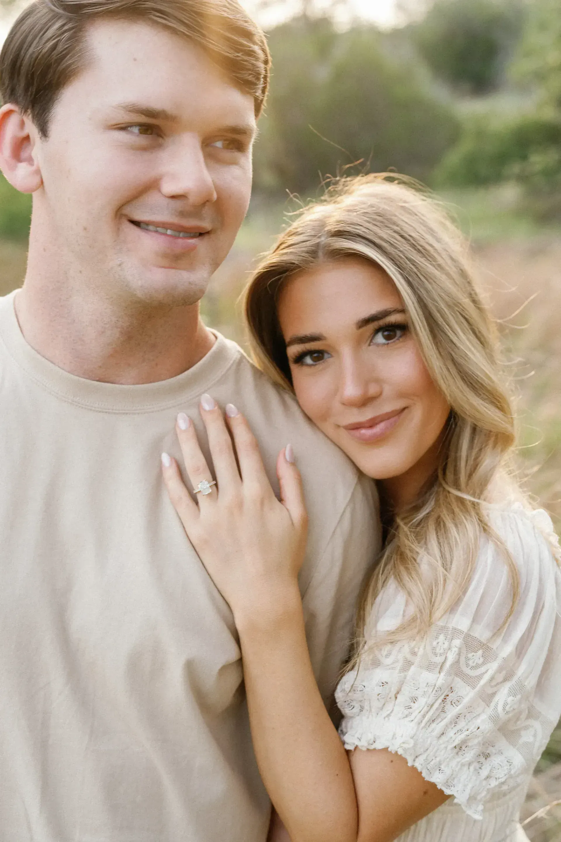 Fashion-inspired engagement portrait with dramatic light in Texas Hill Country