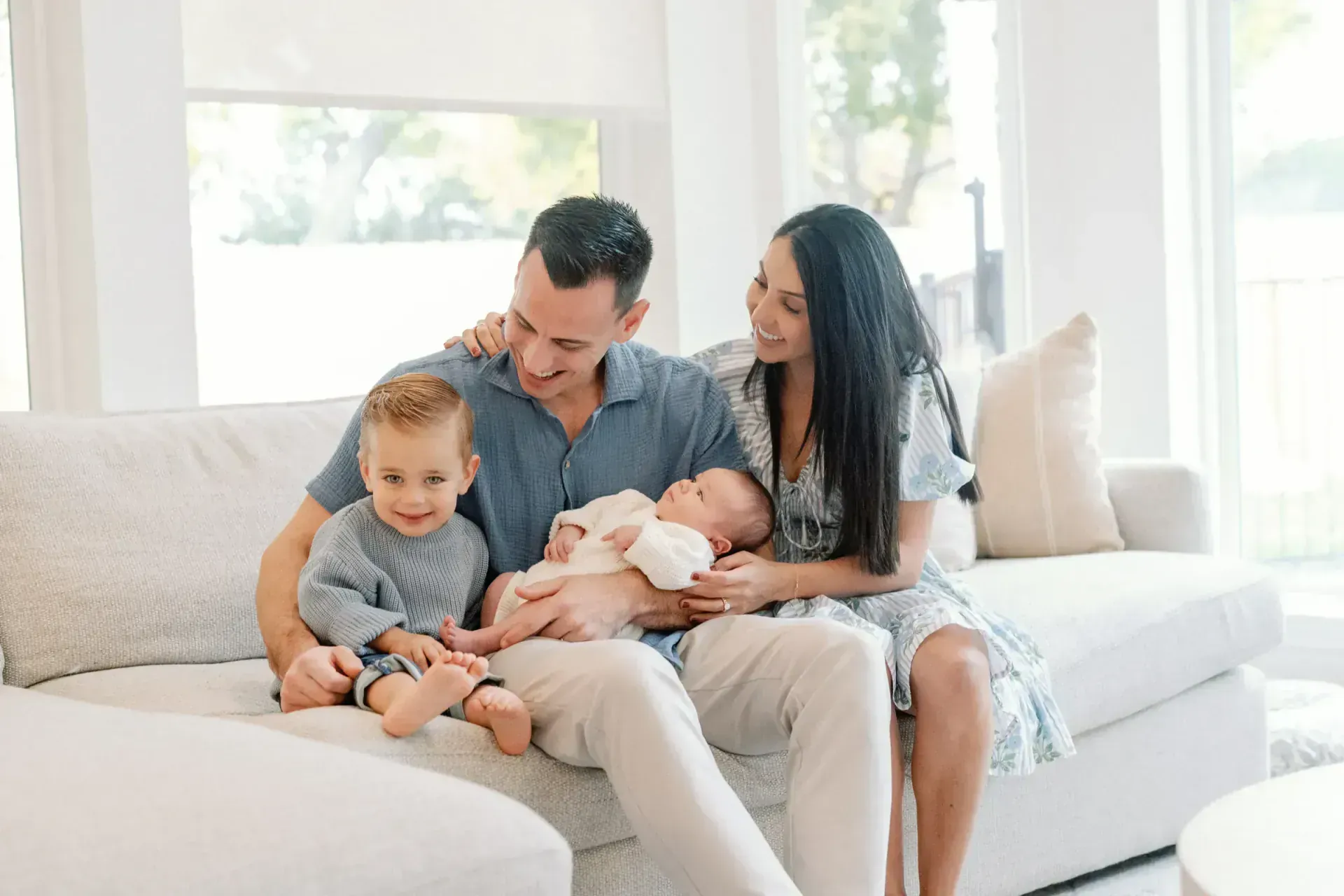 Family laughing together during outdoor portrait session in Texas Hill Country