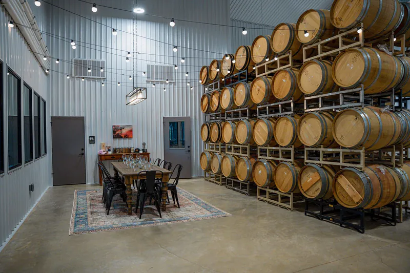 Barrel room inside commercial metal building winery