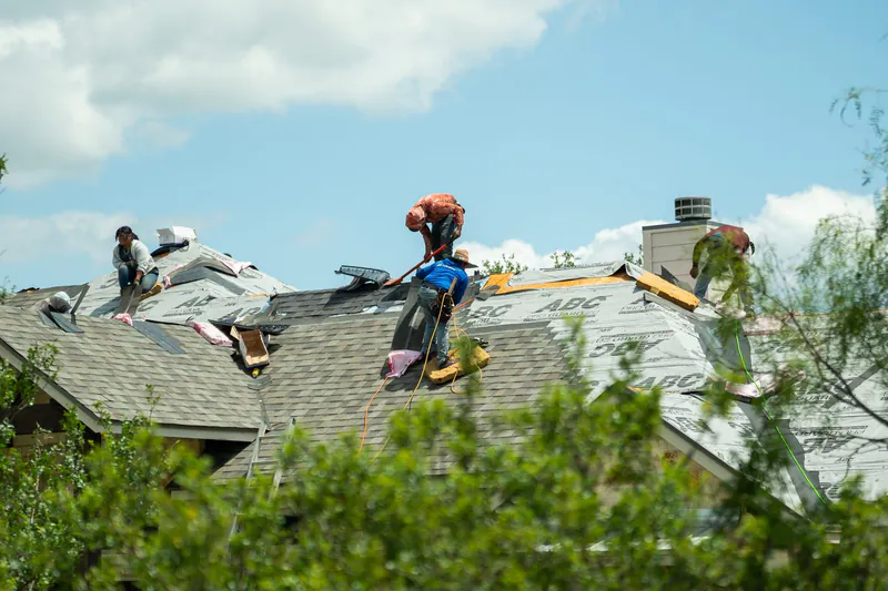 TMB roofing team on large residential roof in Texas